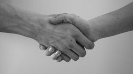 Two people shaking hands after choosing a Contract Manufacturing Partner