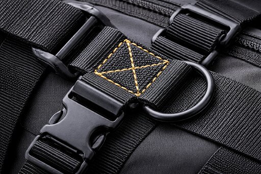 Black custom webbing straps with plastic buckles, D-ring hardware, and reinforced yellow stitching